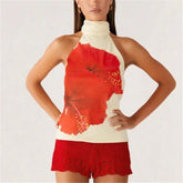 Woman wearing a red and white halter top with lace shorts